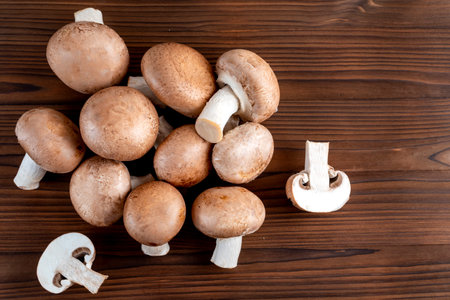 Champignon mushrooms on wooden table. top view with copy spaceの写真素材