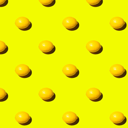 Seamless pattern with lemons on yellow background. top view.の写真素材