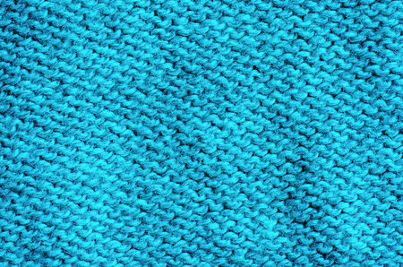 Blue knitted fabric texture background. Close up of knitted fabric.の写真素材