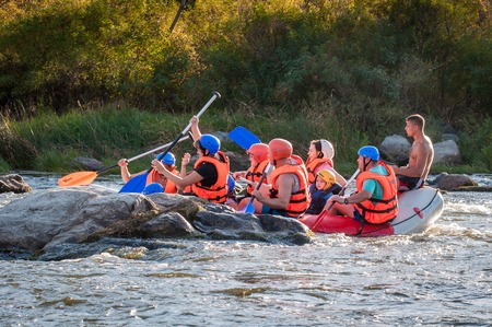 Village Myhiya, Nikolaev region, Ukraine - September 10, 2016: Rafting on the Southern Bug River. An experienced instructor holds the key to a great adventure. Rafting in Ukraine. Fun, risky, bold action.のeditorial素材