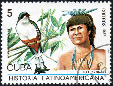 UKRAINE - CIRCA 2017: A stamp printed in Cuba, shows Image of a chieftain Hatuey Cuba and bird Cuban Trogon Priotelus temnurus, the series Latin American history, circa 1987のeditorial素材