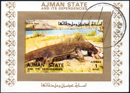 UKRAINE - CIRCA 2017: A stamp printed in AJMAN STATE and its dependencies United Arab Emirates shows varan, series animals, circa 1973のeditorial素材