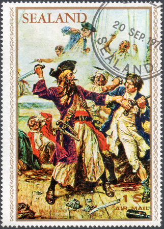 UKRAINE - CIRCA 2017: A stamp printed by Sealand, shows pirate Edward Teach Blackbeard, pirate attack, circa 1970のeditorial素材