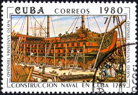 UKRAINE - CIRCA 2017: A postage stamp printed in Cuba shows shipbuilding on shipyard from series Constructing of ships on Cuba, circa 1980のeditorial素材