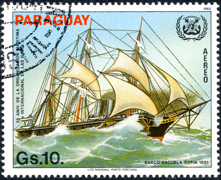 UKRAINE - CIRCA 2017: A postage stamp printed in Paraguai shows sailing ship bark Sofie, from the series 25 years of international Maritime Organization IMO, circa 1983のeditorial素材