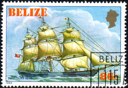 UKRAINE - CIRCA 2017: A postage stamp printed in Belize shows sailing ship Swiftsure 1850, from the series Historic ships, circa 1982のeditorial素材
