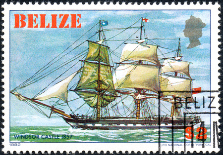 UKRAINE - CIRCA 2017: A postage stamp printed in Belize shows sailing ship Windsor Castle 1857, from the series Historic ships, circa 1982のeditorial素材