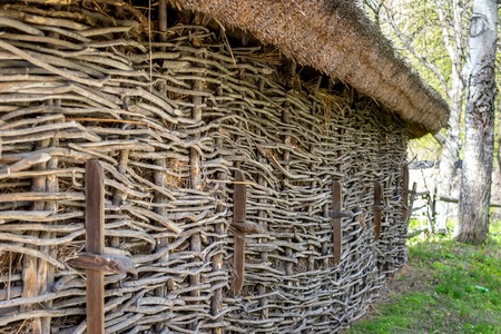 National Museum Pirogovo in the outdoors near Kiev. Vintage background. The wall of an old wooden house, Ukraine. Ancient architecture.のeditorial素材