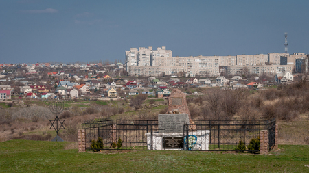 The place where in December 1941 killed more than 54,600 Jews. Ukraine - April 02, 2017: Granite Monument to the victims of the Holocaust in the village of Bogdanovka.のeditorial素材