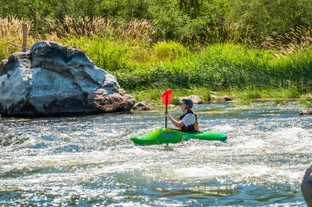 Village Myhiya, Nikolaev region, Ukraine - July 2, 2017: Kayaking on the Southern Bug River in sunny weather. A popular place for extreme recreation and training of rafting and kayaking athletes.のeditorial素材