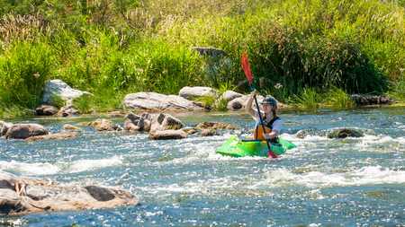 Village Myhiya, Nikolaev region, Ukraine - July 2, 2017: Kayaking on the Southern Bug River in sunny weather. A popular place for extreme recreation and training of rafting and kayaking athletes.のeditorial素材
