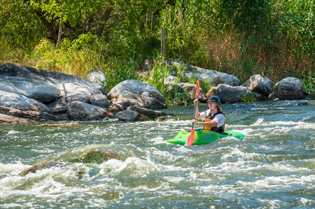 Village Myhiya, Nikolaev region, Ukraine - July 2, 2017: Kayaking on the Southern Bug River in sunny weather. A popular place for extreme recreation and training of rafting and kayaking athletes.のeditorial素材