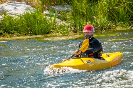 Village Myhiya, Nikolaev region, Ukraine - July 2, 2017: Kayaking on the Southern Bug River in sunny weather. A popular place for extreme recreation and training of rafting and kayaking athletes.のeditorial素材