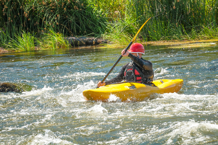 Village Myhiya, Nikolaev region, Ukraine - July 2, 2017: Kayaking on the Southern Bug River in sunny weather. A popular place for extreme recreation and training of rafting and kayaking athletes.のeditorial素材