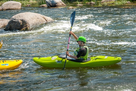 Village Myhiya, Nikolaev region, Ukraine - July 2, 2017: Kayaking on the Southern Bug River in sunny weather. A popular place for extreme recreation and training of rafting and kayaking athletes.のeditorial素材