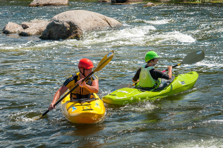 Village Myhiya, Nikolaev region, Ukraine - July 2, 2017: Kayaking on the Southern Bug River in sunny weather. A popular place for extreme recreation and training of rafting and kayaking athletes.のeditorial素材