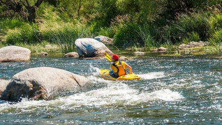 Village Myhiya, Nikolaev region, Ukraine - July 2, 2017: Kayaking on the Southern Bug River in sunny weather. A popular place for extreme recreation and training of rafting and kayaking athletes.のeditorial素材