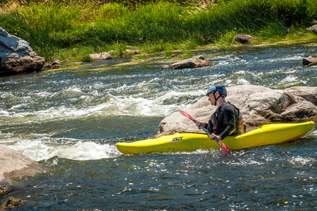 Village Myhiya, Nikolaev region, Ukraine - July 2, 2017: Kayaking on the Southern Bug River in sunny weather. A popular place for extreme recreation and training of rafting and kayaking athletes.のeditorial素材