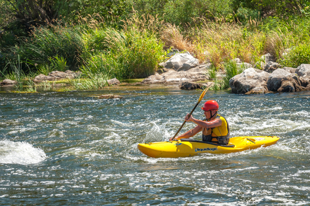 Village Myhiya, Nikolaev region, Ukraine - July 2, 2017: Kayaking on the Southern Bug River in sunny weather. A popular place for extreme recreation and training of rafting and kayaking athletes.のeditorial素材