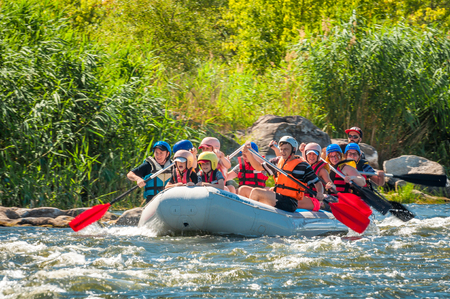 Village Myhiya, Nikolaev region, Ukraine - July 2, 2017: Kids and rafting. A popular place for extreme family recreation and training of athletes in rafting and kayaking.のeditorial素材