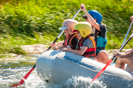 Village Myhiya, Nikolaev region, Ukraine - July 2, 2017: Kids and rafting. A popular place for extreme family recreation and training of athletes in rafting and kayaking.のeditorial素材