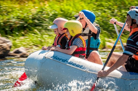 Village Myhiya, Nikolaev region, Ukraine - July 2, 2017: Kids and rafting. A popular place for extreme family recreation and training of athletes in rafting and kayaking.のeditorial素材