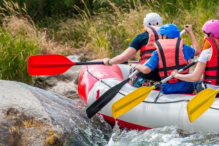Rafting. Close-up view of oars with splashing water.の写真素材