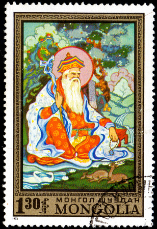 UKRAINE - CIRCA 2017: A postage stamp printed in Mongolia shows Old sage with animals, from the series Paintings by contemporary artists in Ulan Bator Museum, circa 1972のeditorial素材