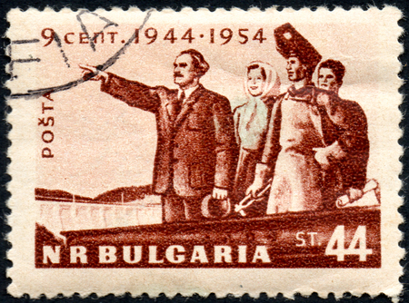 UKRAINE - CIRCA 2017: A postage stamp printed in Bulgaria shows G. Dimitrov with working People, from series 10th Anniversary of the Liberation, circa 1954のeditorial素材