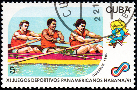 UKRAINE - CIRCA 2017: A postage stamp printed in Cuba shows Rowing from series 11th Pan American Games, circa 1990のeditorial素材