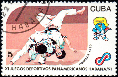 UKRAINE - CIRCA 2017: A postage stamp printed in Cuba shows Judo from series 11th Pan American Games, circa 1990のeditorial素材