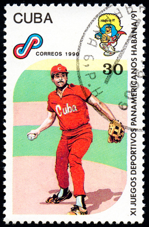 UKRAINE - CIRCA 2017: A postage stamp printed in Cuba shows Baseball from series 11th Pan American Games, circa 1990のeditorial素材