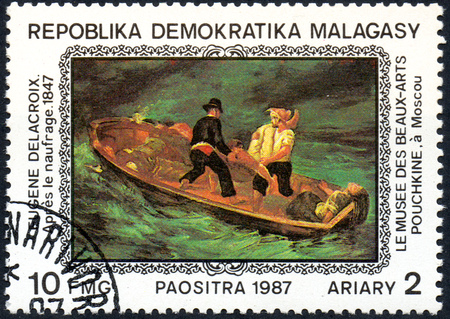 UKRAINE - CIRCA 2017: A postage stamp printed in Madagascar shows Eugene Delacroix: After the Shipwreck 1847, from series Paintings from Pushkin-Museum, Moscow, circa 1987のeditorial素材
