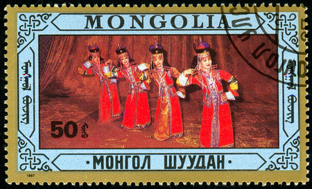Ukraine - circa 2018: A postage stamp printed in Mongolia shows Folk dances. Series: Folklore. Circa 1976.のeditorial素材