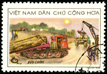 Ukraine - circa 2018: A postage stamp printed in Vietnam shows Timber - hauling lorries. Work on the assembly of wood. Series: Forestry. Circa 1968.のeditorial素材