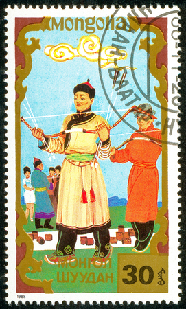 Ukraine - circa 2018: A postage stamp printed in Mongolia shows Archery, Traditional Mongolian sport. Series: Sports. Circa 1988.のeditorial素材