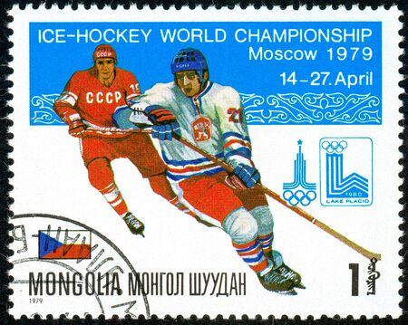 Ukraine - circa 2018: A postage stamp printed in Mongolia show hockey. A players in the uniform of Czechoslovakia, USSR. Flag Czechoslovakia. Series: Moscow ice hockey world championships. Circa 1979.のeditorial素材