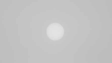 The view of the sun through a dense fog on a winter day. Frost. Minimalism. Soft focusの写真素材