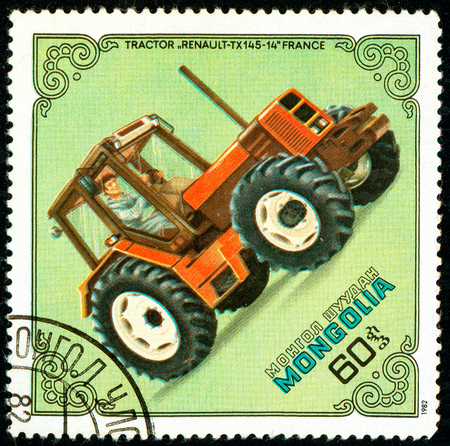 Ukraine - circa 2018: A postage stamp printed in Mongolia show Tractor Renault TX-145-14, France. Series: Tractors. Circa 1982のeditorial素材