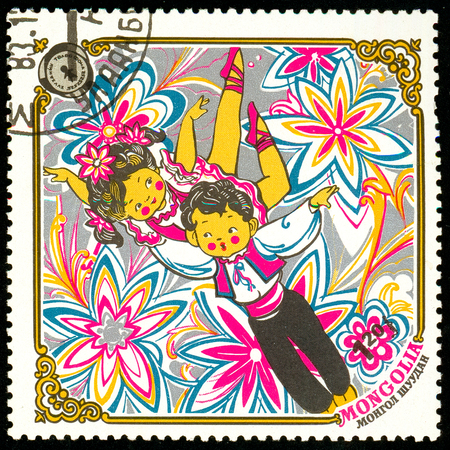 Ukraine - circa 2018: A postage stamp printed in Mongolia show Dancing kids. Series: 10 years Children Fund, Happy childhood. Circa 1983のeditorial素材