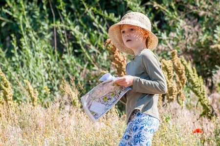 Yuzhnoukrainsk, Ukraine - May 26, 2018: Orienteering race. Traditional annual orienteering game Partisan Spark Cup 2018. Quite young sportswoman is a child on the orienteering trackのeditorial素材