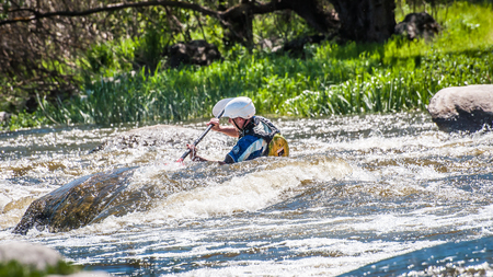 Myhiya, Ukraine - May 1, 2018: Rafting, kayaking. An unidentified man are sailing on his short Dagger whitewater kayak. Extreme sport. Ecological water tourism. Emotions. Water splash close-upのeditorial素材