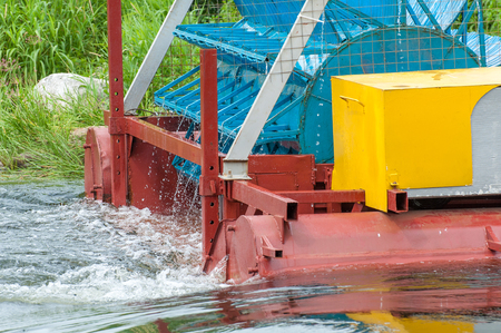 The mini hydroelectric power plant - ecologically clean source of renewable energy. Green energy. The mechanism of close-upの写真素材