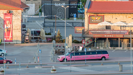 Tallin, Estonia - 24 July 2018: Tallinn. View of the city from the seaport. A long limousine is driving along the streetのeditorial素材