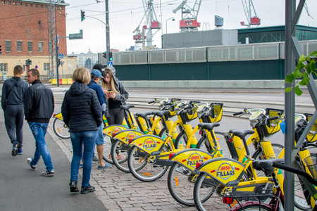 Helsinki, Finland - 4 September 2018: Bicycle rental. Alepa Fillari city bikes parked, waiting for tenantsのeditorial素材