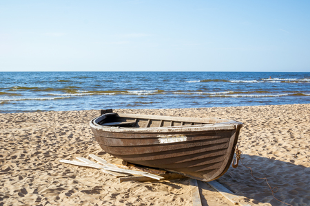 Wooden boat on the coast of the cold Baltic Seaの写真素材
