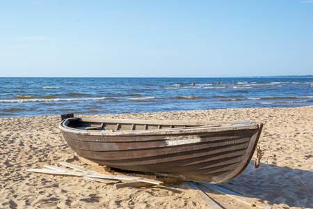Wooden boat on the coast of the cold Baltic Seaの写真素材