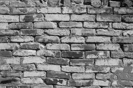 Brick wall close-up. Brick laying on cement mortarの写真素材