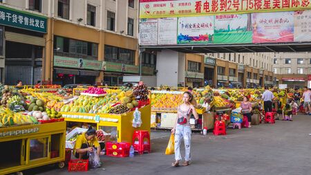 Sanya, Hainan, China - May 18, 2019: Typical Asian fruit market. Fresh tropical fruits are on the market window. Healthy, organic foodのeditorial素材