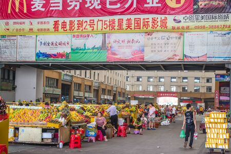 Sanya, Hainan, China - May 18, 2019: Typical Asian fruit market. Fresh tropical fruits are on the market window. Healthy, organic foodのeditorial素材